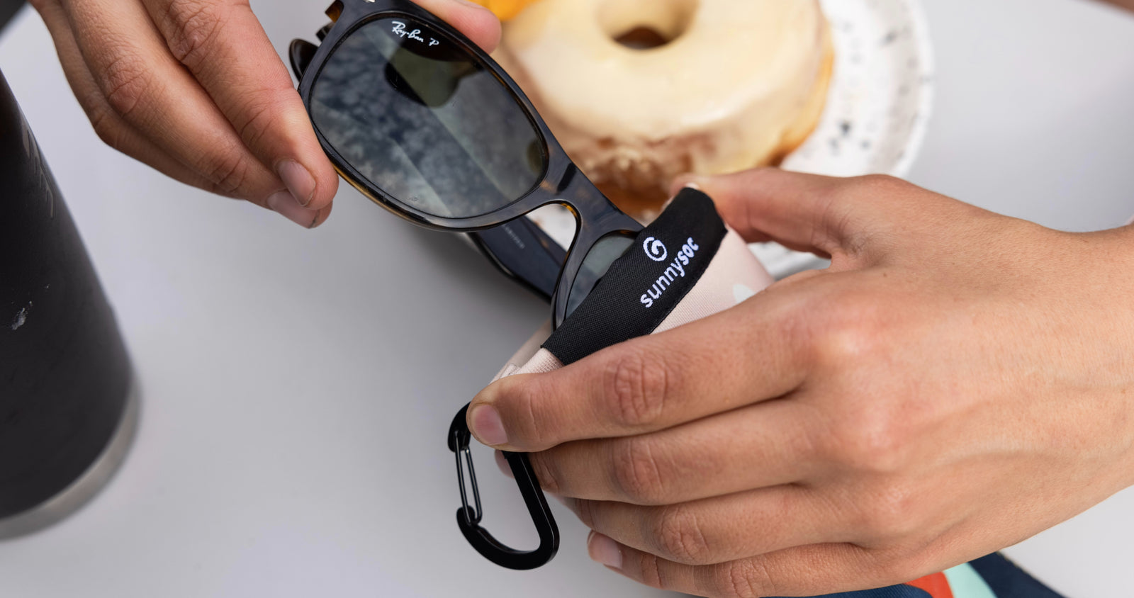 sunnysoc sunglass and eyewear case on in the forest by a mountain bike