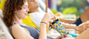 Woman sits holding her sunnysoc